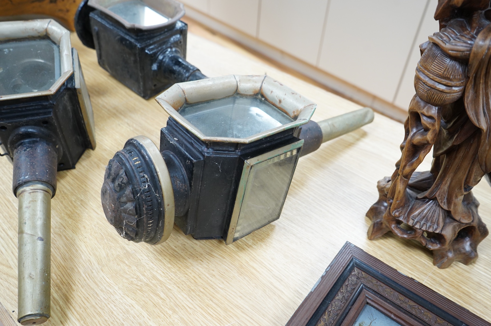 A pair of late 19th century carriage lamps and another
